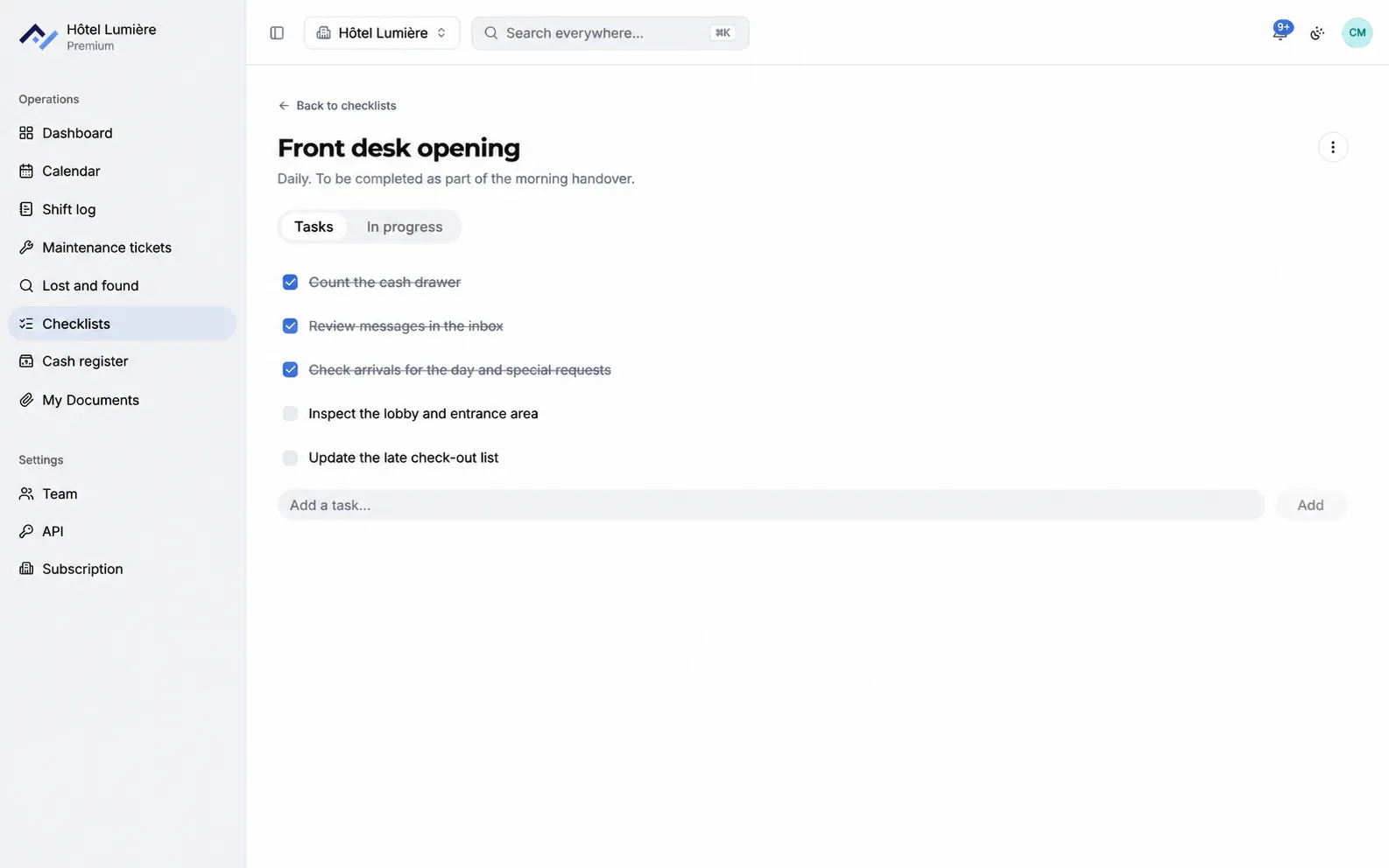 A front desk opening checklist open in Front Desk: five tasks, three of them already ticked off and struck through, and a field to add another one.
